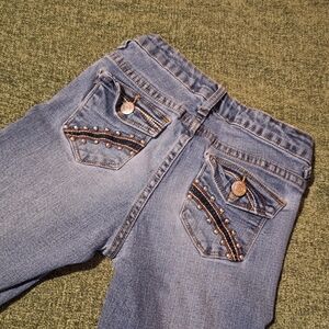 Stylish Blue Women's Jeans with Embellished Pockets